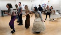 Actors in rehearsals in dance routine