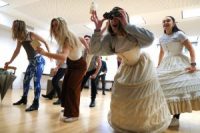 Actors in rehearsals, in dance routine