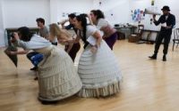 Actors in rehearsals, in Edwardian costume