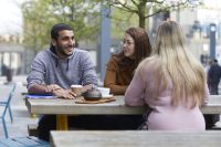 Students drinking coffee outside