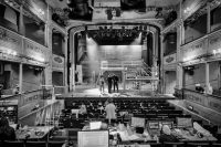 Students in a technical rehearsal in front of the main stage in Bristol Old Vic's auditorium